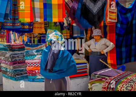 OTAVALO, ECUADOR, NOVEMBER 06, 2018: Outdoor view of hispanic indigenous people in a street market in Otavalo Stock Photo