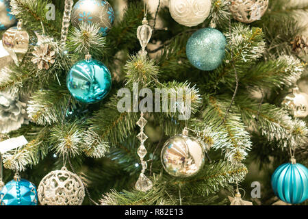 Spruce branches, fir cones and Christmas decorations. Christmas still life. Christmas decorations on music sheets, closeup. Stock Photo