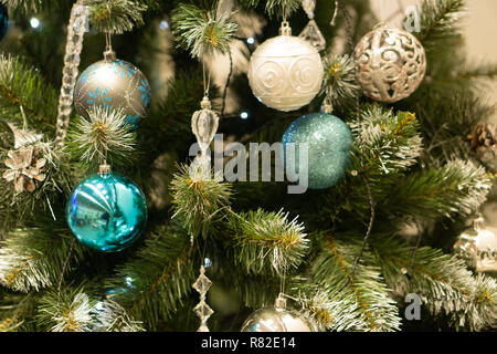 Spruce branches, fir cones and Christmas decorations. Christmas still life. Christmas decorations on music sheets, closeup. Stock Photo