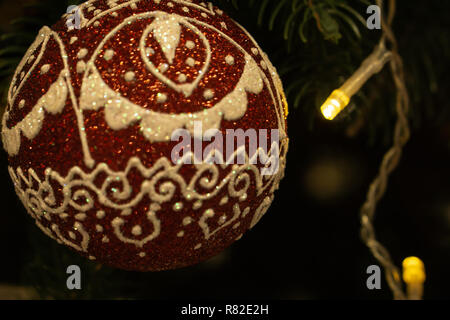 Spruce branches, fir cones and Christmas decorations. Christmas still life. Christmas decorations on music sheets, closeup. Stock Photo
