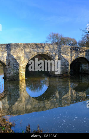 The medieval Teston Bridge over the River Medway in Kent on a bright, crisp winter morning in December. Kent, UK Stock Photo