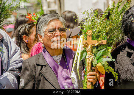 QUITO, ECUADOR- MARCH 23, 2018: Outdoor view of unidentified woman participating in the celebration of Palm Sunday before Easter Stock Photo