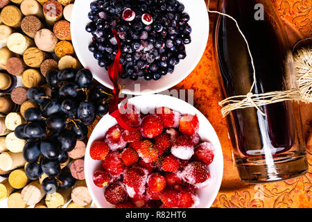 strawberry, blueberry, grape on wine corks, red wine with ripe, antioxidants, resveratrol flavonoids rich food Stock Photo