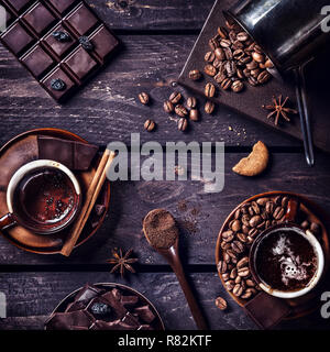 Coffee and dark chocolate with spices on the dark wooden table Stock Photo