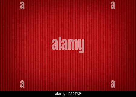 Red corrugated cardboard close up. Large texture and background with vignette Stock Photo