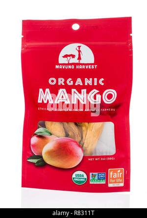 Winneconne, WI - 8 December 2018: A package of Mavuno Harvest organic mangoes on an isolated background. Stock Photo