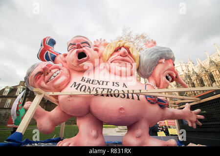 London UK. 12th December 2018. A sculpture of  lookalike effigies of Prime Minister Theresa May, Boris Johnson, Michael Gove and David Davis are paraded around Westminster against Brexit. Prime Minister Theresa May faces a no confidence vote after the required number of letters were submitted to the Chairman of the 1922 Committee Sir Graham Brady  Credit: amer ghazzal/Alamy Live News Stock Photo
