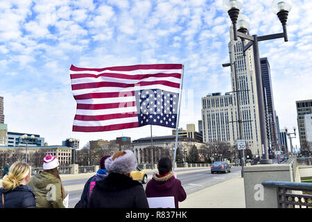 Columbus, Ohio, USA. 12th Dec, 2018. A woman seen holding a flag during the protest.Protesters marched to the Ohio State House in Columbus, Ohio to protest the controversial Heartbeat Bill or HB258, which bans abortion once a fetal heartbeat is detected. The bill would make it much more difficult for women to seek an abortion in the state of Ohio. The bill was passed by members of the Ohio Senate with a vote of 18-13. Credit: ZUMA Press, Inc./Alamy Live News Stock Photo