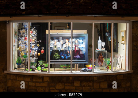 Broadway art gallery window on the high street in december at night. Broadway, Cotswolds, Worcestershire, England Stock Photo