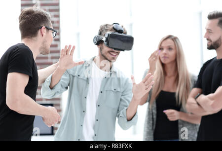 Positive colleagues testing virtual reality glasses Stock Photo