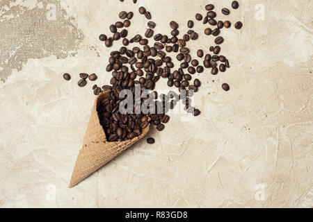 coffee beans in heart shape on background fabrics of jute Stock Photo