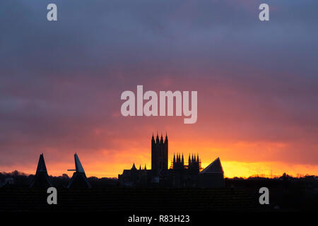 Vibrant sunrise over Canterbury Cathedral during December. Kent, UK. Stock Photo