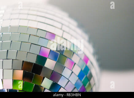 Close up view of colorful disco ball with multicolored reflections. Preparing for a fun night party or holiday at home Stock Photo