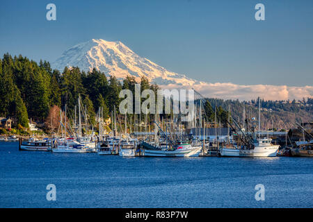 GIG HARBOR, WASHINGTON, DECEMBER 7, 2013: Commercial fishing vessels sit idle, as unusually cold weather causes ice to form in the harbor. Stock Photo