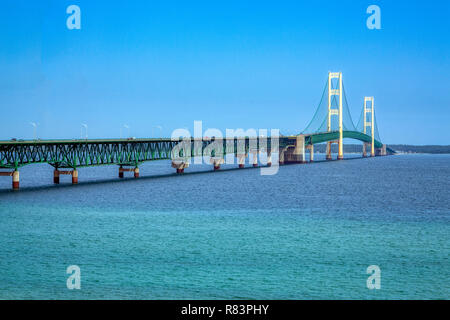 The Mackinac Bridge, opened in 1957, spans the Straits of Mackinac to connect Michigan's upper and lower peninsulas. Stock Photo