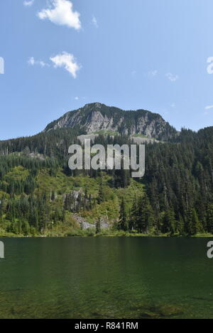 Scenic mountain and trail views of both Bearhead Trail and the Granite Lakes in the Pacific Northwest. Washington State's Mt. Rainer takes background. Stock Photo