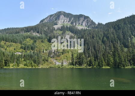 Scenic mountain and trail views of both Bearhead Trail and the Granite Lakes in the Pacific Northwest. Washington State's Mt. Rainer takes background. Stock Photo