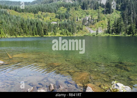 Scenic mountain and trail views of both Bearhead Trail and the Granite Lakes in the Pacific Northwest. Washington State's Mt. Rainer takes background. Stock Photo