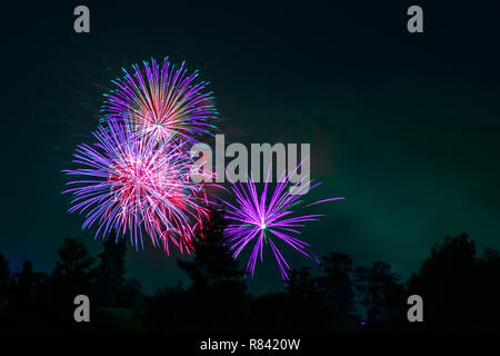Colorful fireworks display on a dark sky background; Celebrations, Festivals, Independence Day, 4th of July or New Year Stock Photo