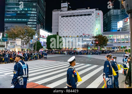 Tokyo policeman on duty at Shibuya crossing during Halloween celebration. Halloween has become increasingly popular in Japan in the recent years. Stock Photo
