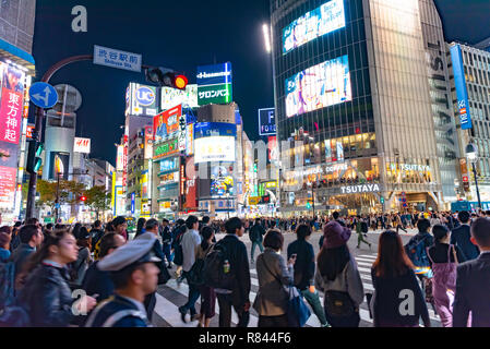 Pedestrians crosswalk at Shibuya district in Tokyo, Japan. Shibuya Crossing is one of the busiest crosswalks in the world. Stock Photo