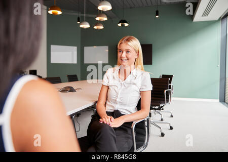 Businesswoman Interviewing Female Candidate At Graduate Recruitment Assessment Day In Office Stock Photo