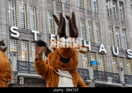 Hamburg Germany - 8  December 2018:  Reindeer puppet waving in Hamburg Christmas parade Stock Photo