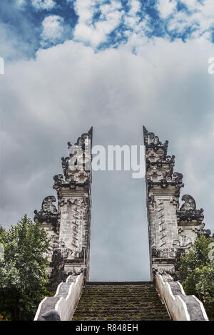 Main entrance to Pura Penataran Agung Lempuyang in Bali, Indonesia. Summer landscape with religious buildings by cloudy blue sky. Gates of heaven Stock Photo