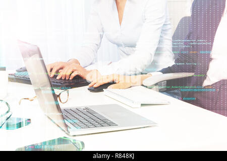 Close-up picture of female hands using computer keyboard and mouse at the desk in the office Stock Photo