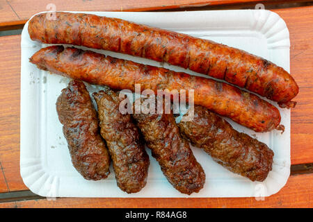 Romanian street food (mititei and semi smoked sausages) Stock Photo