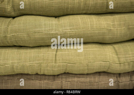 Multicolored cushions or pillows on display in store Stock Photo