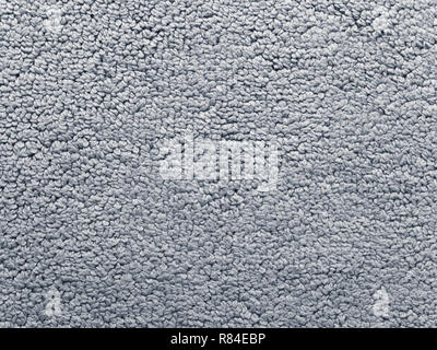 Bath rug gray cotton terry fabric texture. Terrycloth texture swatch. Stock Photo