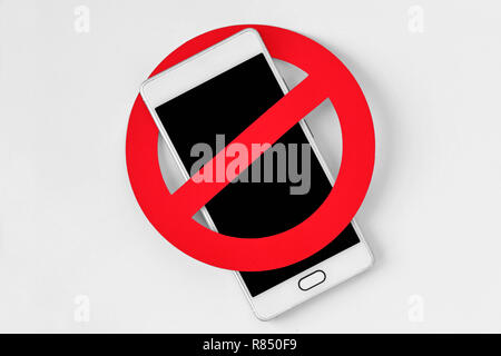 Mobile phone with prohibition sign on white background - No mobile phone concept Stock Photo