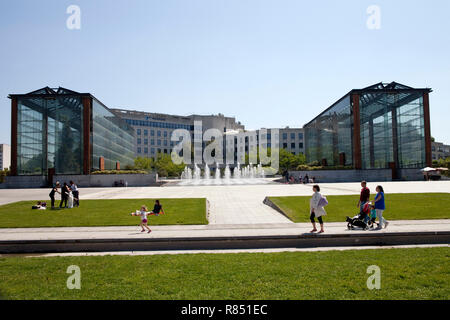 Paris (France): public park 'Parc Andre Citroen in the 15th arrondissement (district). Overview of the park with the big greenhouses in the background Stock Photo