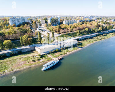 Aerial view of peaceful city center of Bendery (Bender), embarkment of Dniester river with a pleasure boat, in unrecognised Transnistria (Moldova) Stock Photo