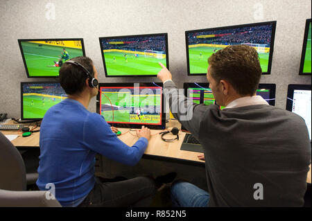 VAR referee Bas Nijhuis (left) and his operator Mike van der Roest (right) working at the VAR center in the headquarters of the Dutch football associa Stock Photo