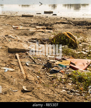 Polluted river bank by some random trash making huge ecological problem in Serbia Stock Photo