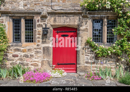 A bright red door marks the entrance to Kiplin Hall, Richmond, Yorkshire , UK Stock Photo