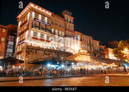 Porto, Portugal - September 27, 2018: Porto, Nightlife on the crowded promenade of the Douro River with cafes and restaurants in Porto Stock Photo