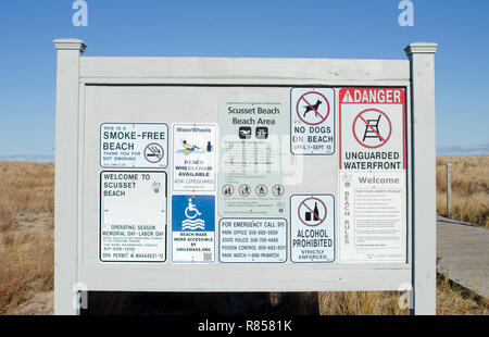 Sign board with rules and regulations at Scusset Beach, Cape Cod in Sagamore, Bourne, Massachusetts USA with no alcohol allowed, no smoking, no dogs Stock Photo