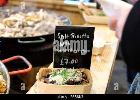 A food stall selling spelt risotto with wild mushrooms at Borough Market in London England UK  KATHY DEWITT Stock Photo