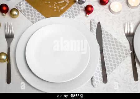 Top view on empty white plate on Christmas Eve table Stock Photo