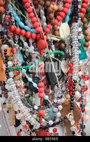 Loads of all sorts of rosaries left at Our Lady of Guadalupe Shrine in Des Plaines, Illinois, USA. Nuestra Senora de Guadalupe. Stock Photo
