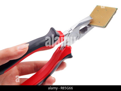 Modern central computer processors CPU clamped in the pliers Stock Photo