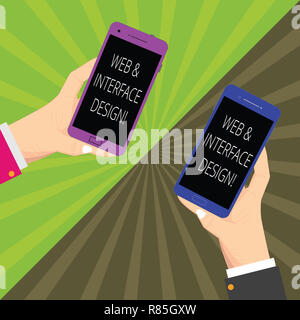 Word writing text Web And Interface Design. Business concept for Website designers online sites developing Two Hu analysis Hands Each Holding Blank Sm Stock Photo