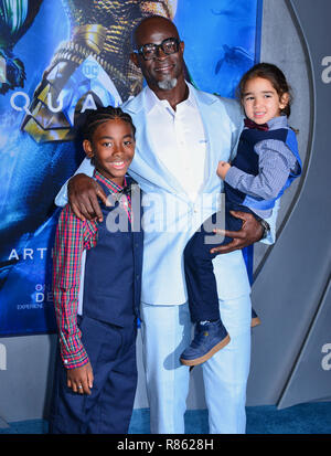 Djimon Hounsou  and kids  arrives at the Premiere Of Warner Bros. Pictures' Aquaman at TCL Chinese Theatre on December 12, 2018 in Hollywood, California Stock Photo