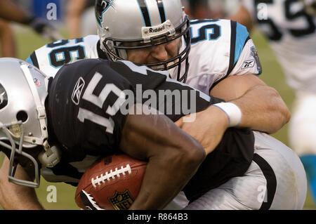 Carolina Panthers linebacker Jason Kyle hammers down Green Bay Packers  running back Brandon Jackson on a second quarter run. The Panthers defeated  the Packers 35-31, on Sunday, December 30, 2008, at Lambeau