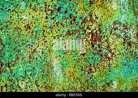 blurred abstract background of old iron with cracked paint of green, blue and brown colors Stock Photo