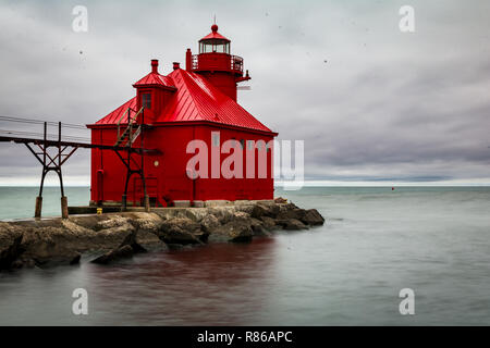 Stormy skies on a cold fall/autumn day looking out at the pier head lighthouse, Sturgeon Bay, Door County, Wisconsin. Stock Photo