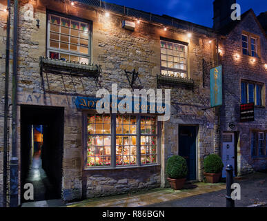 Durham house antiques centre christmas shop window display at night. Stow on the Wold, Cotswolds, Gloucestershire, England Stock Photo